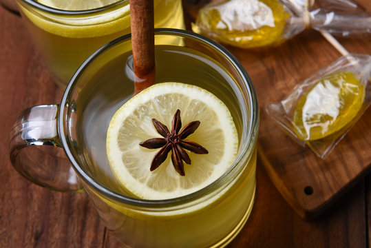 Overhead View Of A Hot Toddy In A Glass Mug On A Dark Wood Table