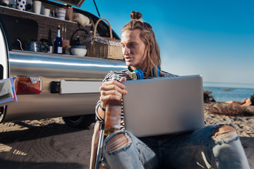 Freelancers working. Couple of experienced modern freelancers living in mobile home working using...