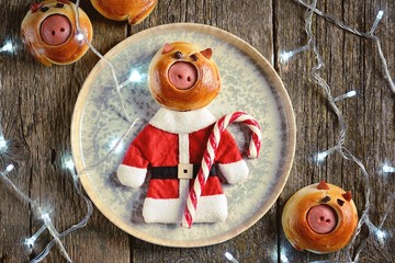 Cute Santa pig buns with sausages - symbol of 2019, the idea for children's breakfast.