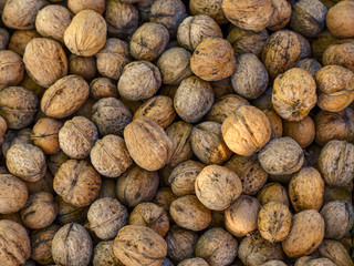 Top view of whole walnuts as background texture