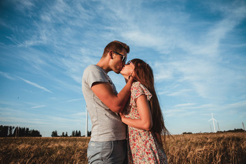 Young couple in love in the field