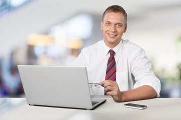 Young business man holding books