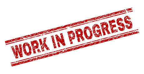 WORK IN PROGRESS seal print with grunge texture. Red vector rubber print of WORK IN PROGRESS tag with dust texture. Text tag is placed between double parallel lines.