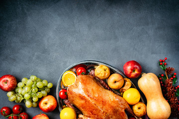 Thanksgiving roasted whole goose on rustic table - obrazy, fototapety, plakaty