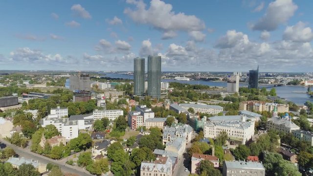 4K Riga City Bridges and towers living houses buildings drone Flight Old town air flight with cars near daugava river and Library