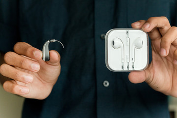 Hearing aid and earphone. The concept of hearing care.