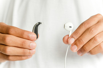 Hearing aid and earphone. The concept of hearing care.