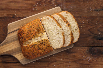 Bread and slices on a cutting board.