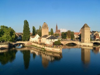 Obraz premium The City of Strasbourg from the lake of the city on a blue sky summer day, France