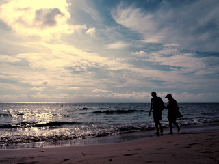 Lovely couple walking on the White Sand Beach, Koh Chang Thailand.