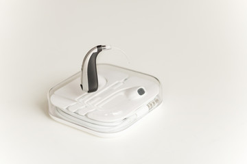 Hearing aid and earphone. The concept of hearing care.