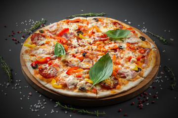 Pizza with sausage and Basil