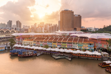 Colorful light building at night in Clarke Quay, Singapore. Clarke Quay, is a historical riverside quay in Singapore. - obrazy, fototapety, plakaty