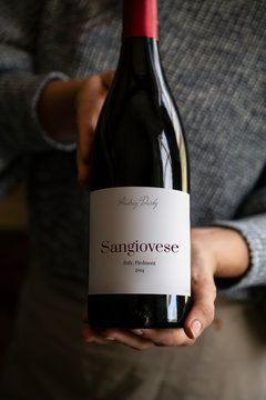 Woman holding a bottle of wine