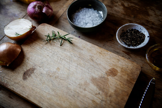 Empty Wooden Chopping Board With Spices And Herbs