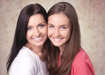 Happy Mother and daughter on background
