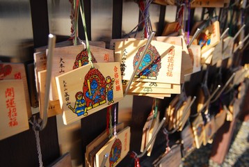 Ema, the wooden boards to write wishes and pray for god, hung up at temple and shine in Japan.