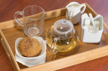 Hot tea on a tray with cookies