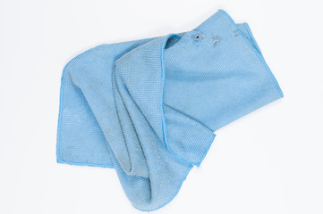 Blue folded microfiber cloth isolated on white background