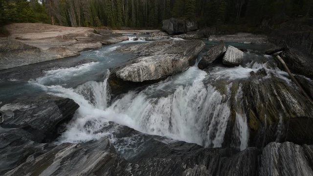 Natural Bridge and sinkhole rock formation over Kicking Horse River in Yoho National Park, British Columbia, Canada