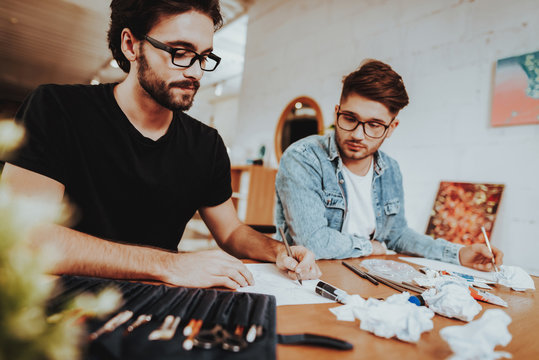 Two Talanted Freelance Artists Drawing Indoors