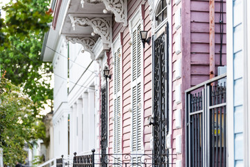 New Orleans, USA Old street historic district in Louisiana famous town, city, pink painted house...