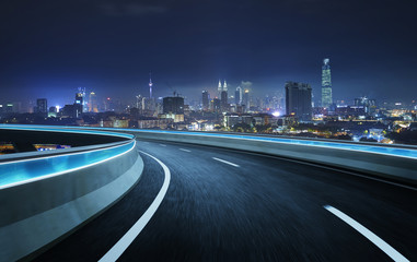 Fototapeta na wymiar Highway overpass motion blur with city background . night scene .