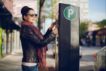woman pays for Parking