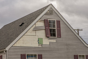 high winds have damaged the siding of your home