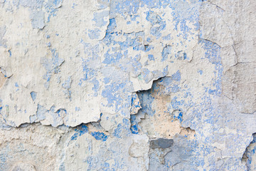 Old weathered blue plaster wall texture. Grunge background.