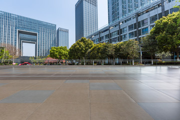 Panoramic skyline and modern business office buildings with empty road,empty concrete square floor