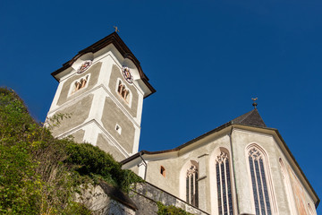 Fototapeta na wymiar View of Catholic church in famous Hallstatt alpine village in Austria