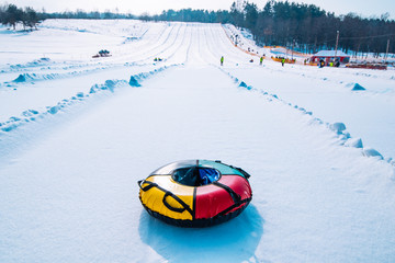 snow tubing. sleigh on the top of the hill. winter activity