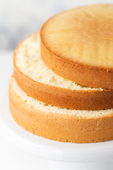 Sponge cake. Shortcakes on a white cake stand, selective focus