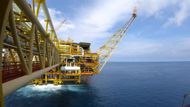 Oil and gas industry. A 4K 30fps timelapse of gas platform in somewhere at South China Sea with dramatic clouds movement. 