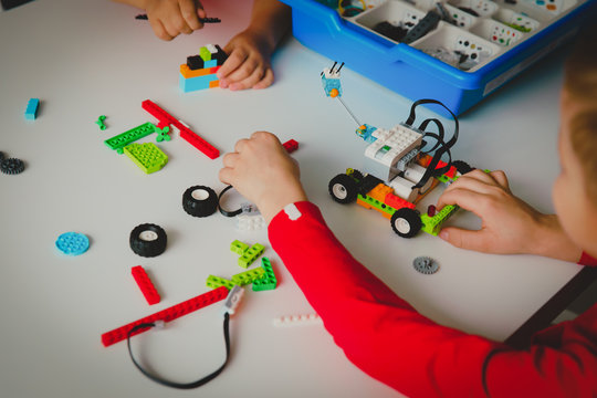 kids building robot at robotic technology school lesson