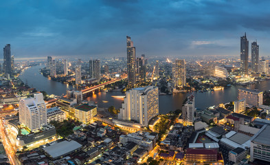 Scenic view curved of the Chao Phraya River in Bangkok city downtown during twilight, capital of Thailand. - obrazy, fototapety, plakaty