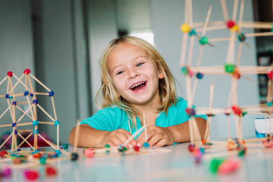 little girl making geometric shapes, engineering and STEM