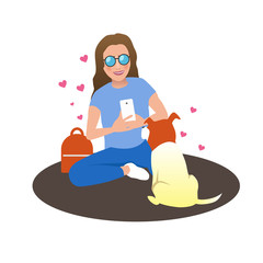 girl taking pictures of her dog on phone