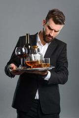 Tired waiter holding full tray