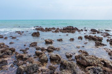 Rocks on the beach and turquoise sea
