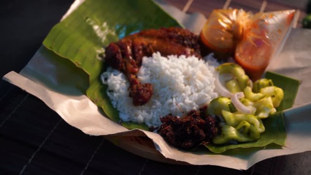 nasi lemak kukus with drumpstick malaysian local food