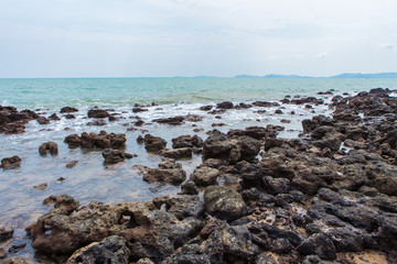 Rocks on the beach and turquoise sea