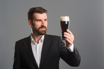 Smiling man holding beer glass