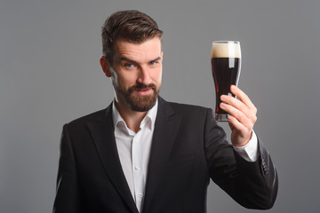 Man holding glass of beer