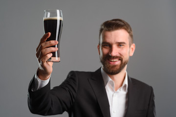 Smiling man raised his glass