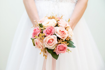 Wedding bouquet of flowers in the hands of the bride - obrazy, fototapety, plakaty