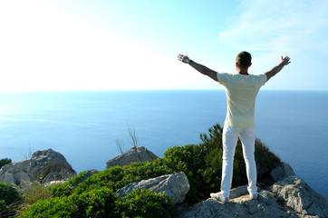 man on top of mountain