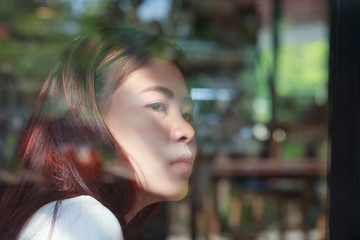 Asia woman feel sadness in cafe.