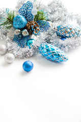 Christmas composition. Christmas balls, blue and silver decoration on white background.
